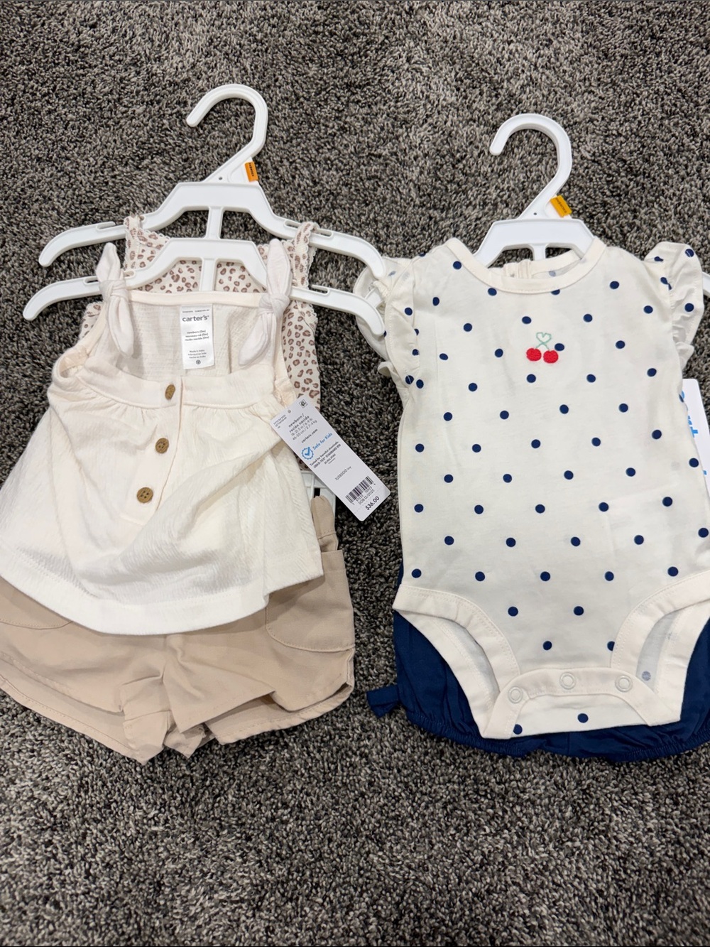 Set of 2 NWT Carter's outfits. Size newborn